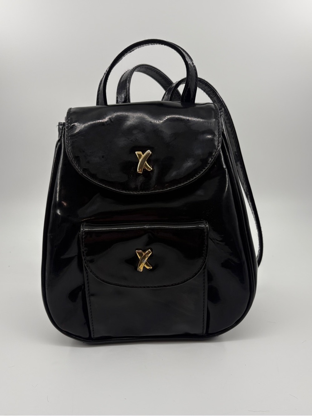 Paloma Picasso Black Patent Mini Backpack with Gold X Hardware